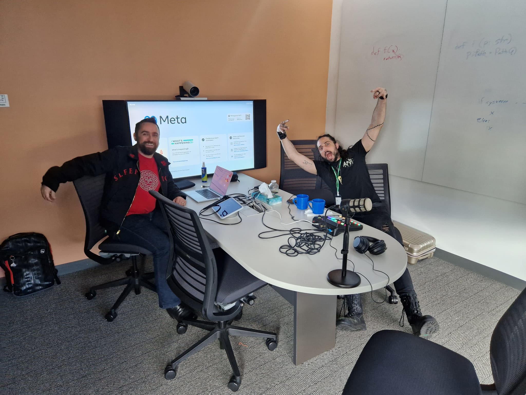 Łukasz and Pablo in their ad-hoc podcast studio in a Meta meeting room.